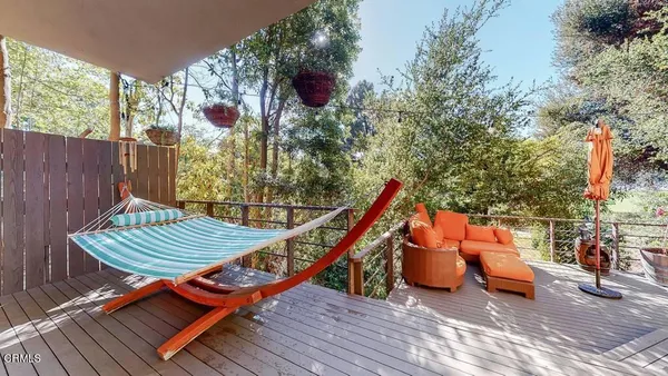 a view of a backyard with sitting area