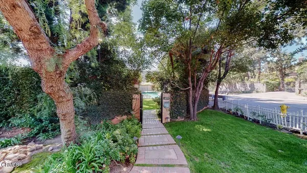 a view of balcony with wooden floor and fence