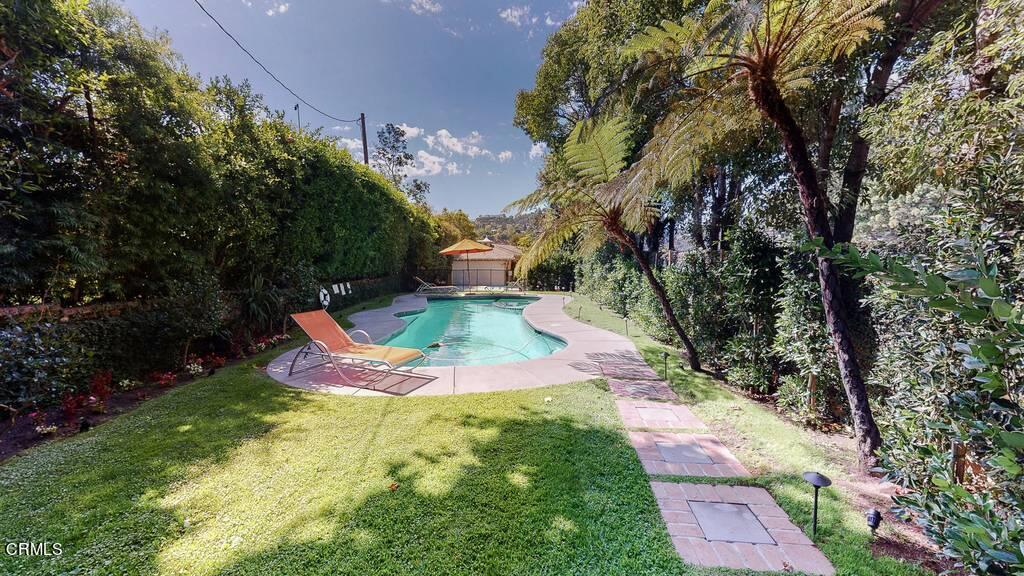 101 South Rockingham Avenue Los Angeles, CA 90049 - Photo 40 of 44 a view of outdoor space yard deck patio and fire pit