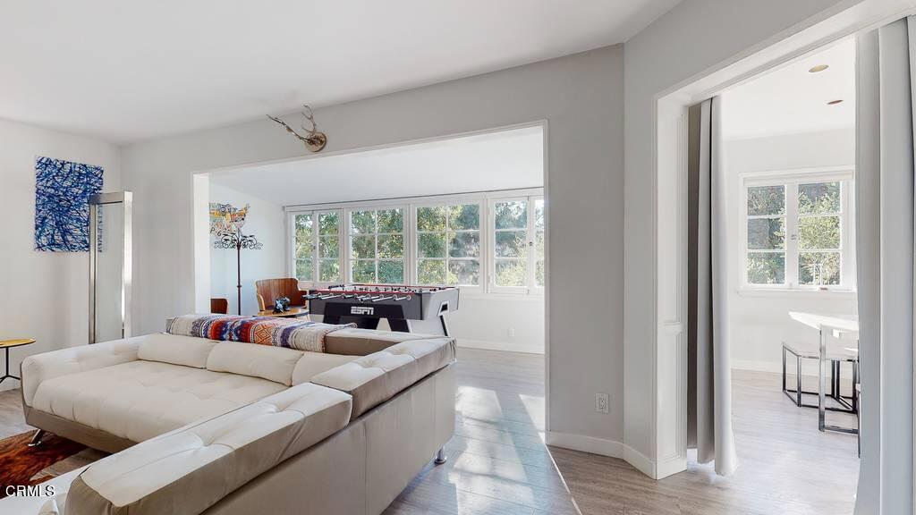 101 South Rockingham Avenue Los Angeles, CA 90049 - Photo 5 of 44 a living room with furniture and a window