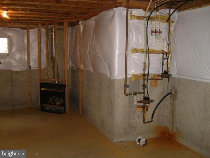 12019 Fort Washington Road Fort Washington, MD 20744 - Photo 9 of 14 Unfinished Basement w/Gas Fireplace built in!