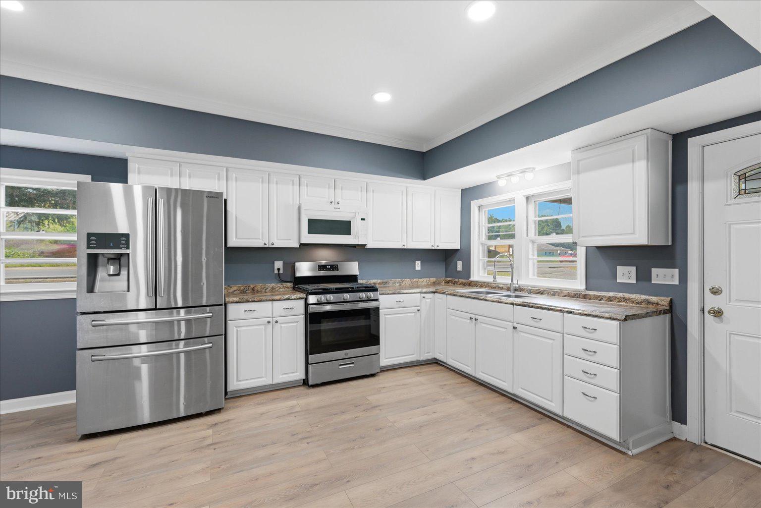 3571 Catlett Road Catlett, VA 20119 - Photo 6 of 22 a kitchen with granite countertop cabinets a stainless steel appliances and a window