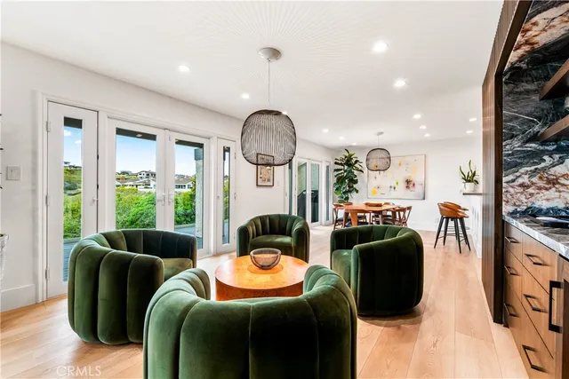 a kitchen with granite countertop a stove top oven sink and cabinets