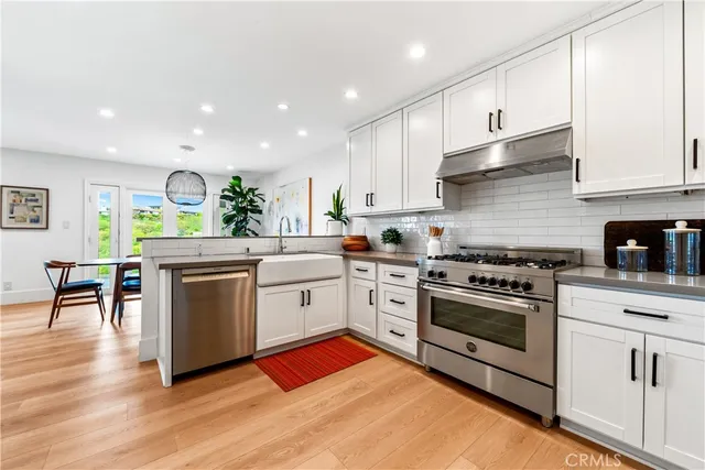 a bedroom with two beds and a window