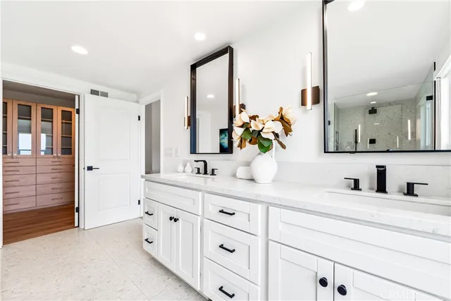 an aerial view of residential houses with outdoor space and ocean view