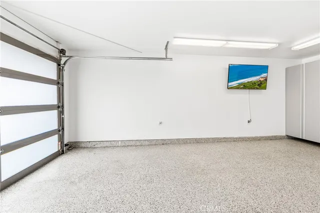 an aerial view of a house with a yard and outdoor seating