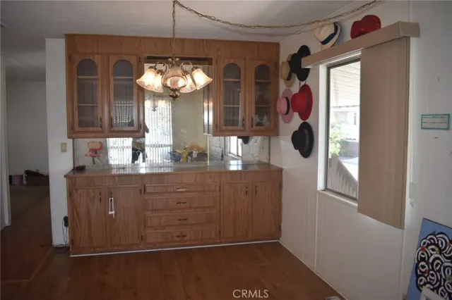 a bathroom with a sink mirror and window