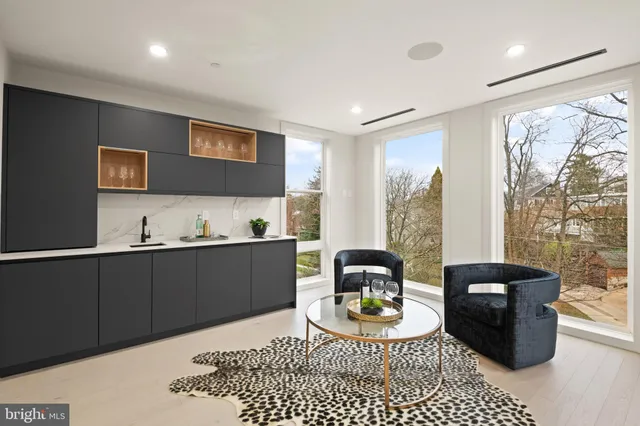 a bedroom with a bed couch and window