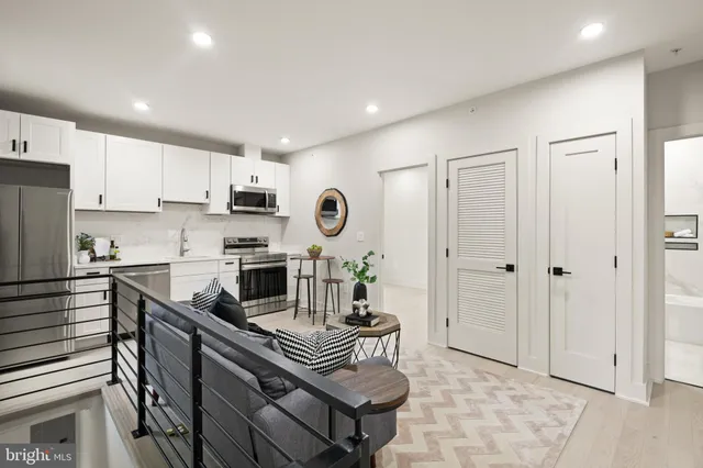 a bathroom with a sink mirror toilet and bathtub