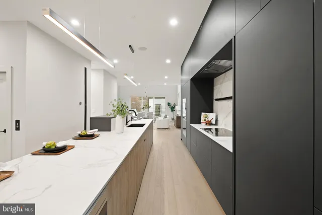 a kitchen with a stove and a refrigerator
