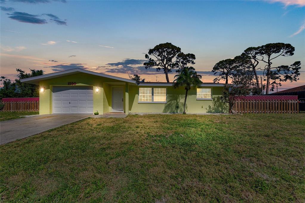 1550 Royal Road Venice, FL 34293 - Photo 1 of 1 a front view of a house with a garden