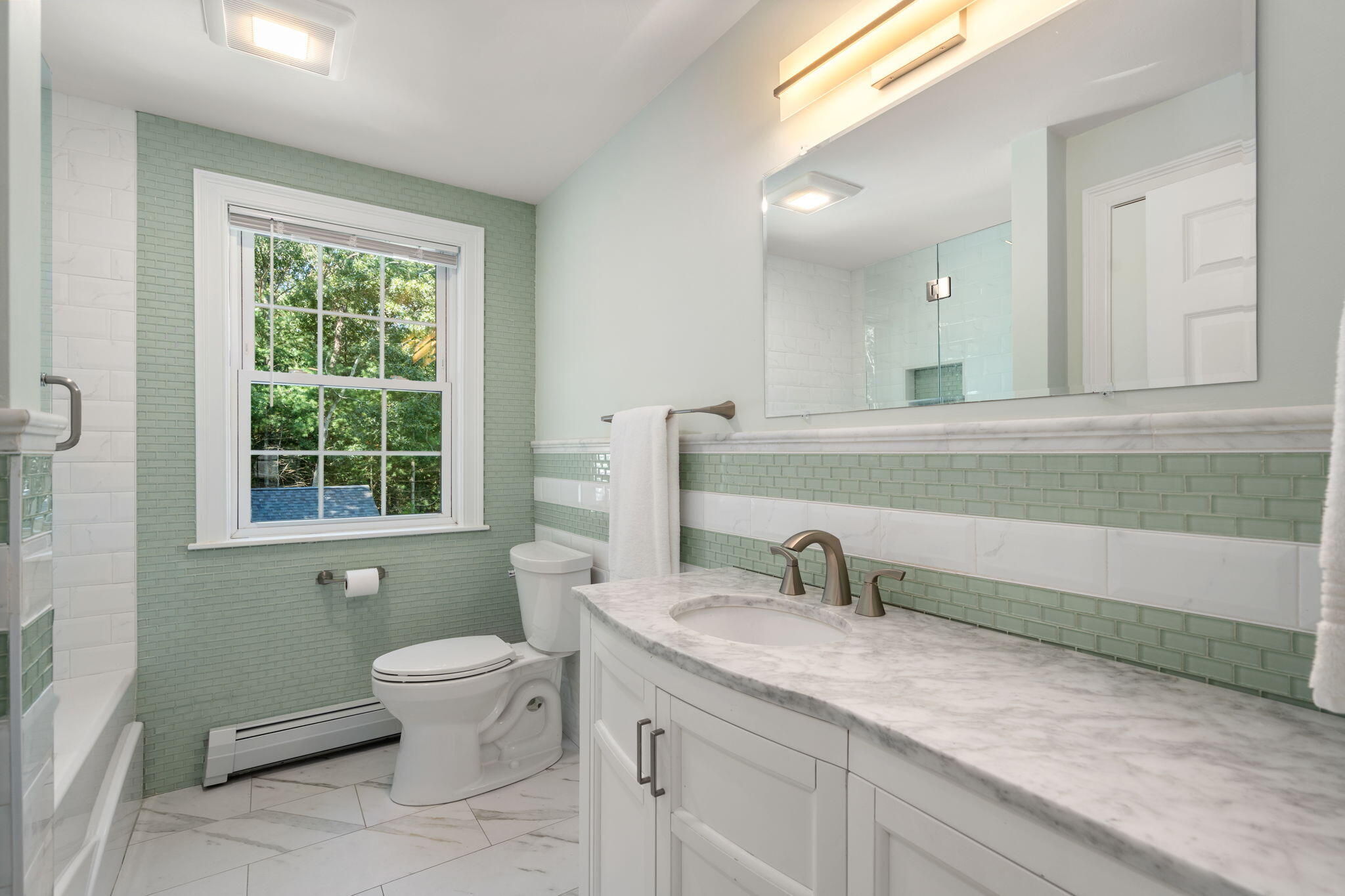 41 Old Fields Road Sandwich, MA 02563 - Photo 25 of 47 a bathroom with a granite countertop toilet a sink a mirror and a window