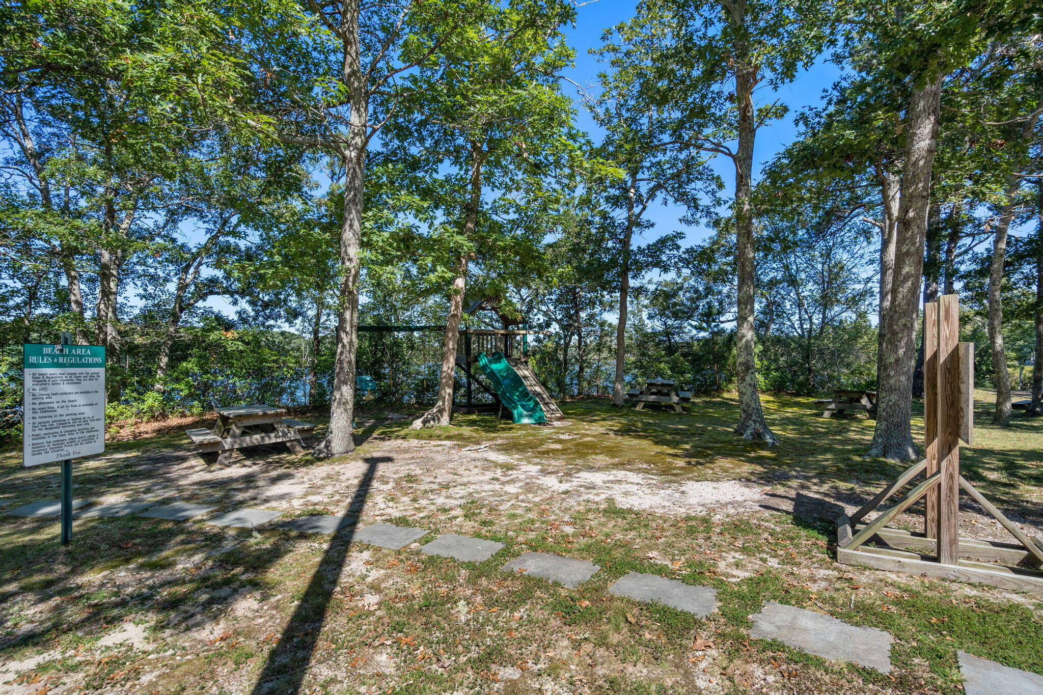 41 Old Fields Road Sandwich, MA 02563 - Photo 45 of 47 a backyard of a house with table and chairs