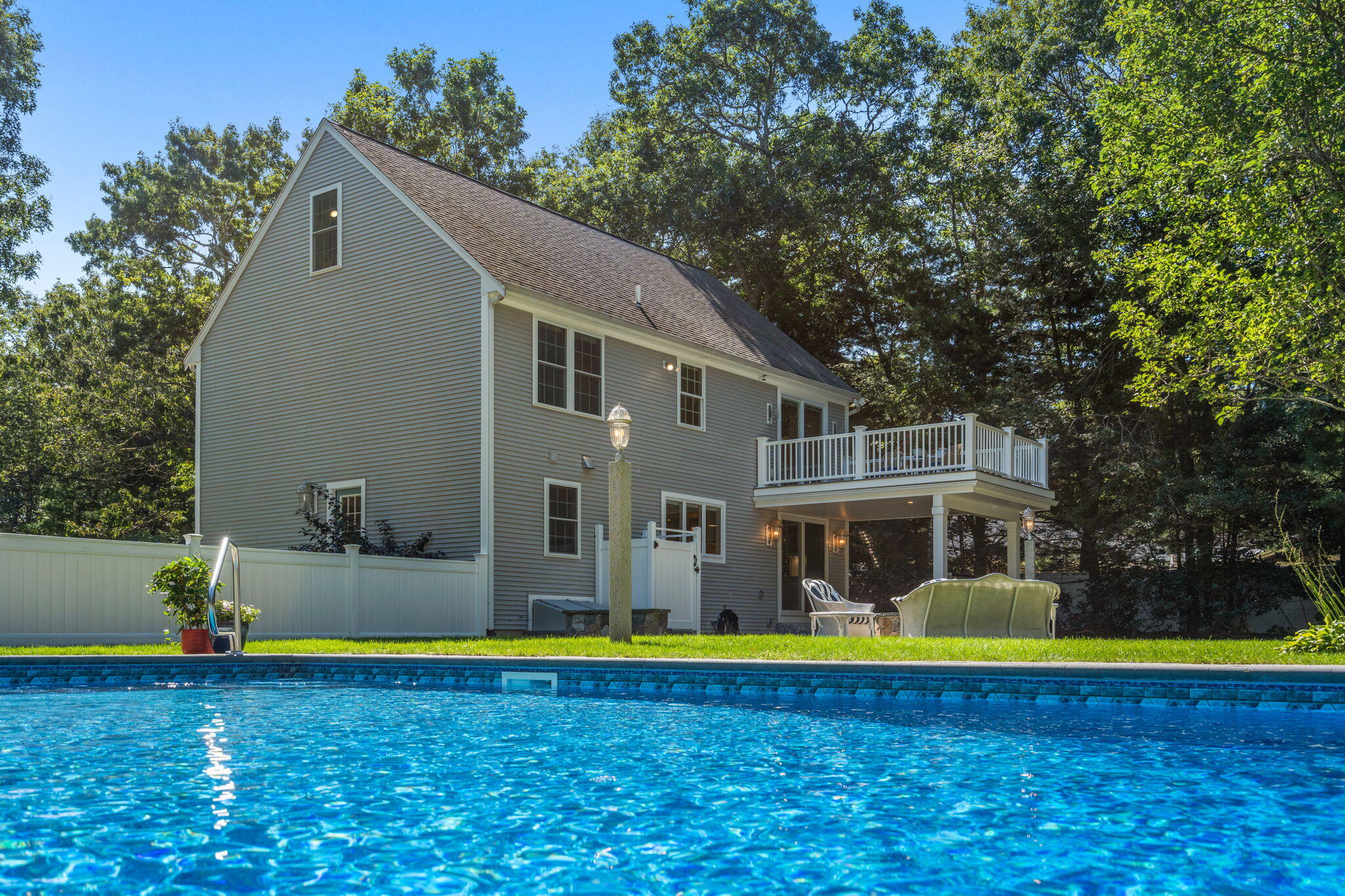 41 Old Fields Road Sandwich, MA 02563 - Photo 5 of 47 a view of swimming pool with umbrella and large trees