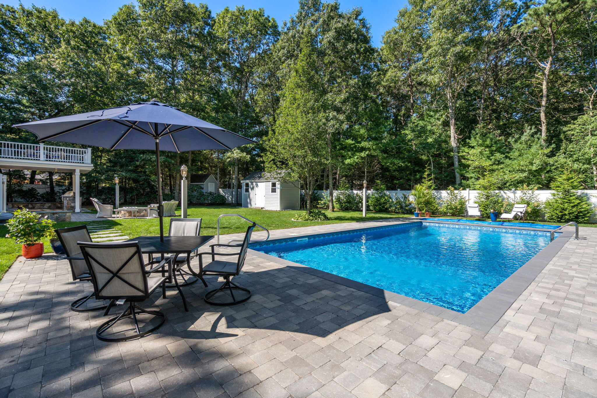 41 Old Fields Road Sandwich, MA 02563 - Photo 6 of 47 a view of a swimming pool with chairs in patio