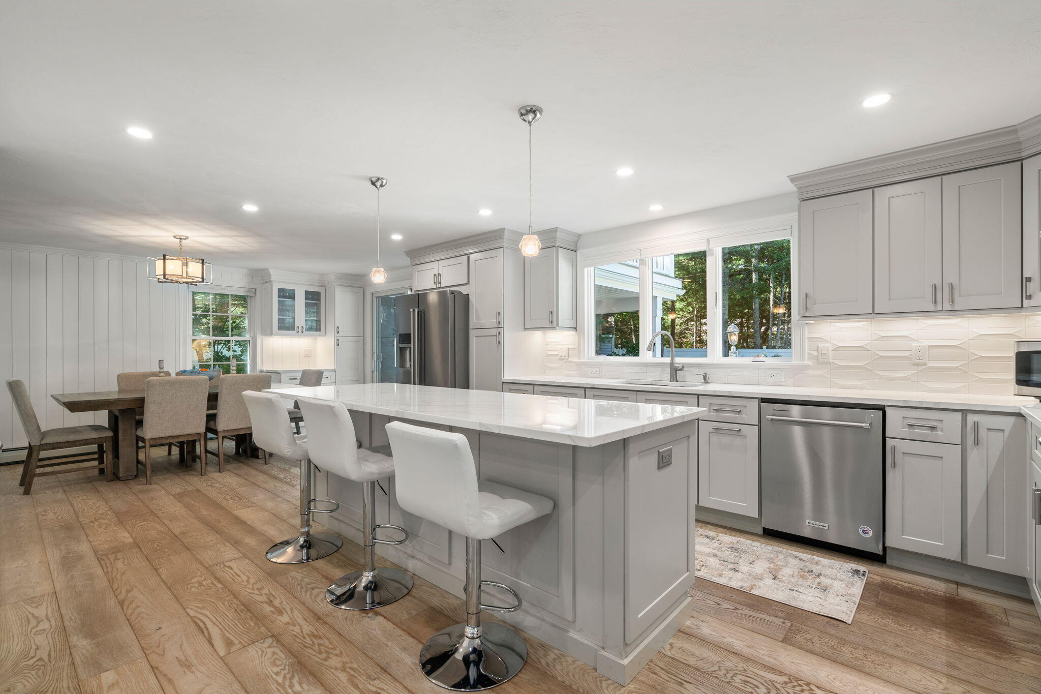 41 Old Fields Road Sandwich, MA 02563 - Photo 8 of 47 a large kitchen with kitchen island a sink table and chairs