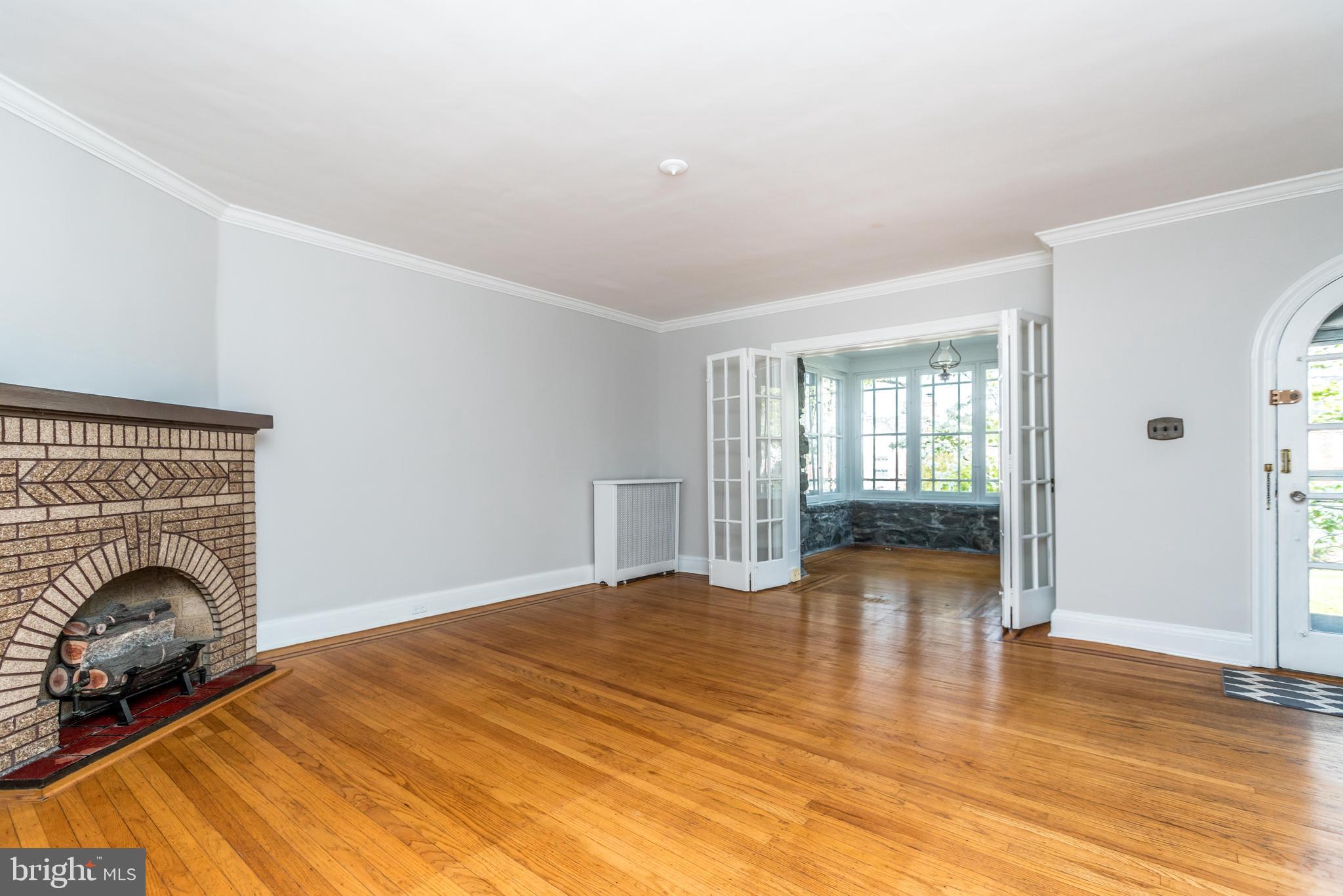 3612 Ednor Road Baltimore, MD 21218 - Photo 3 of 32 Living Room Into Sunroom