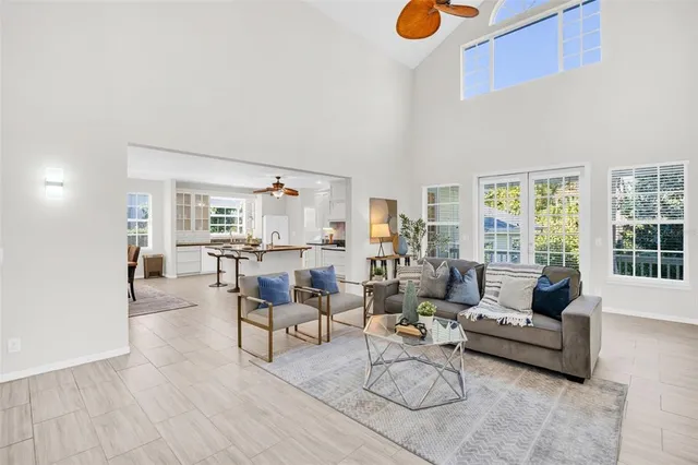 a kitchen with granite countertop a stove a sink and a refrigerator