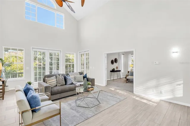 a kitchen with stainless steel appliances granite countertop a sink dishwasher and a stove with wooden floor