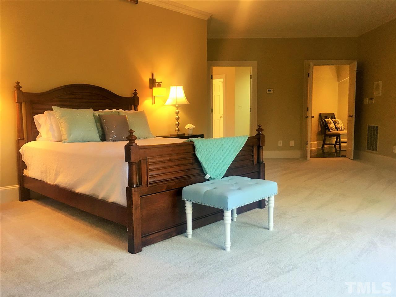 1917 Torrey Pines Place Raleigh, NC 27615 - Photo 14 of 25 a bedroom with a bed and chair