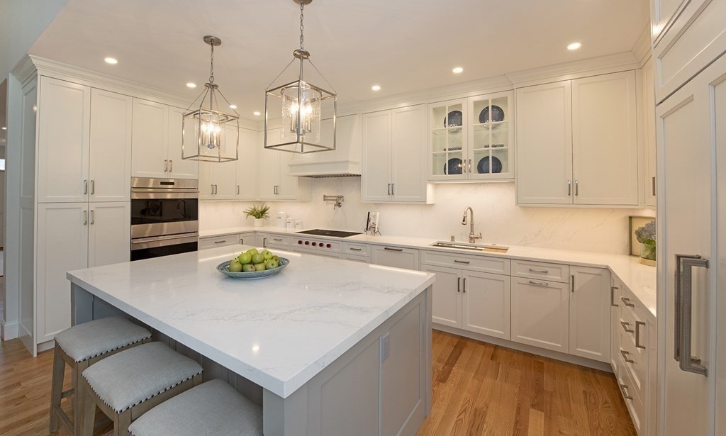 10 Trevino Circle Andover, MA 01810 - Photo 11 of 33 a kitchen with kitchen island a white cabinets and wooden floor