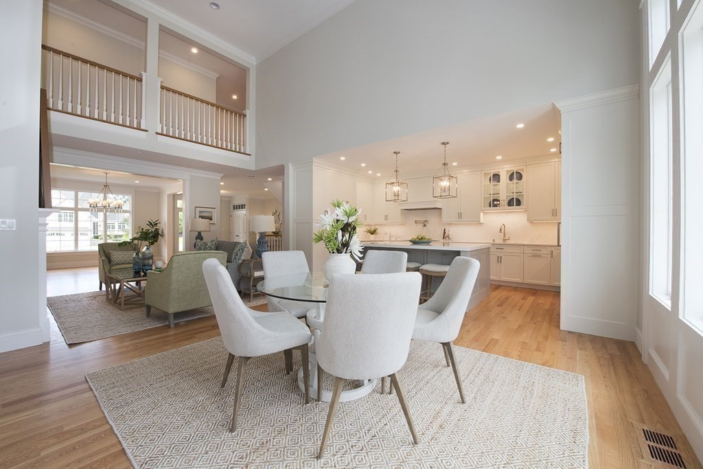 10 Trevino Circle Andover, MA 01810 - Photo 14 of 33 a dining room with furniture a kitchen view and wooden floor