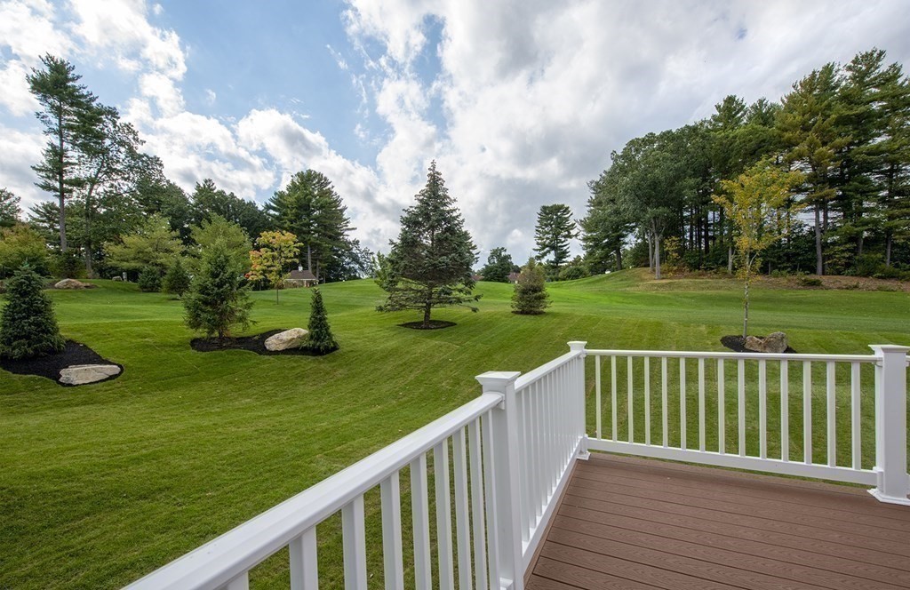 10 Trevino Circle Andover, MA 01810 - Photo 17 of 33 a view of a deck and yard with green space