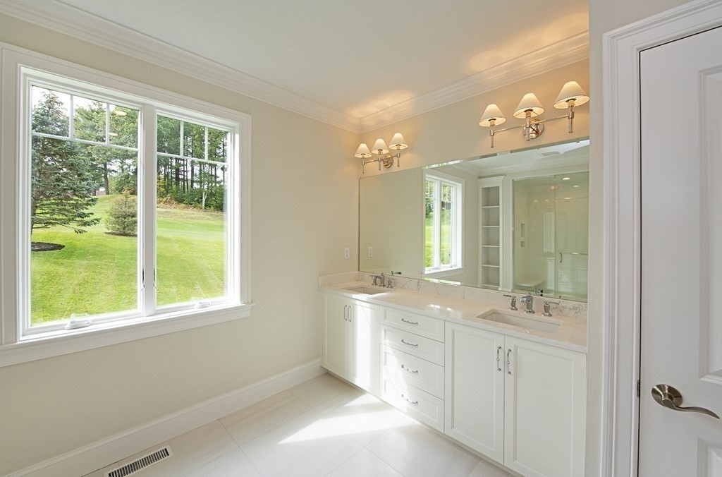 10 Trevino Circle Andover, MA 01810 - Photo 26 of 33 a bathroom with a double vanity sink and mirror with window