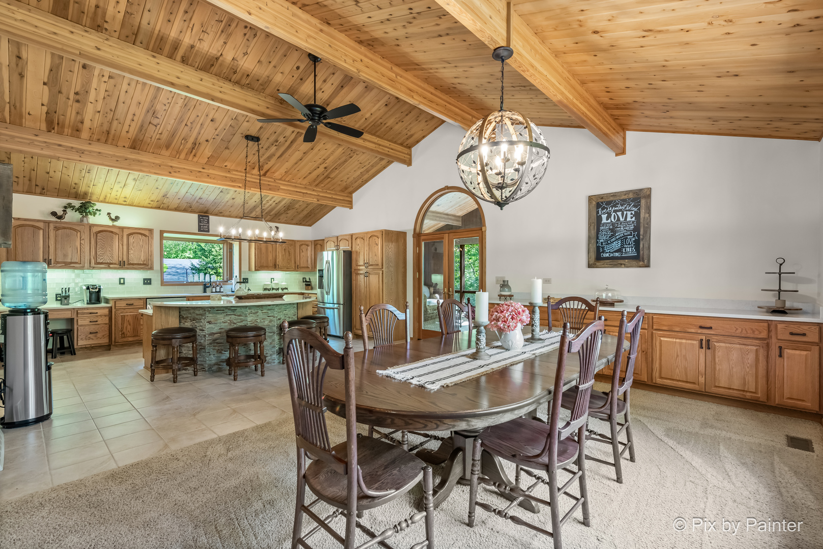 3804 Ridge Road Spring Grove, IL 60081 - Photo 14 of 55 a view of a dining room with furniture a kitchen and chandelier