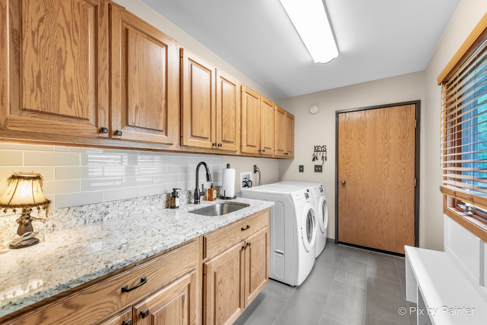 3804 Ridge Road Spring Grove, IL 60081 - Photo 28 of 55 a kitchen with stainless steel appliances granite countertop a sink stove and cabinets