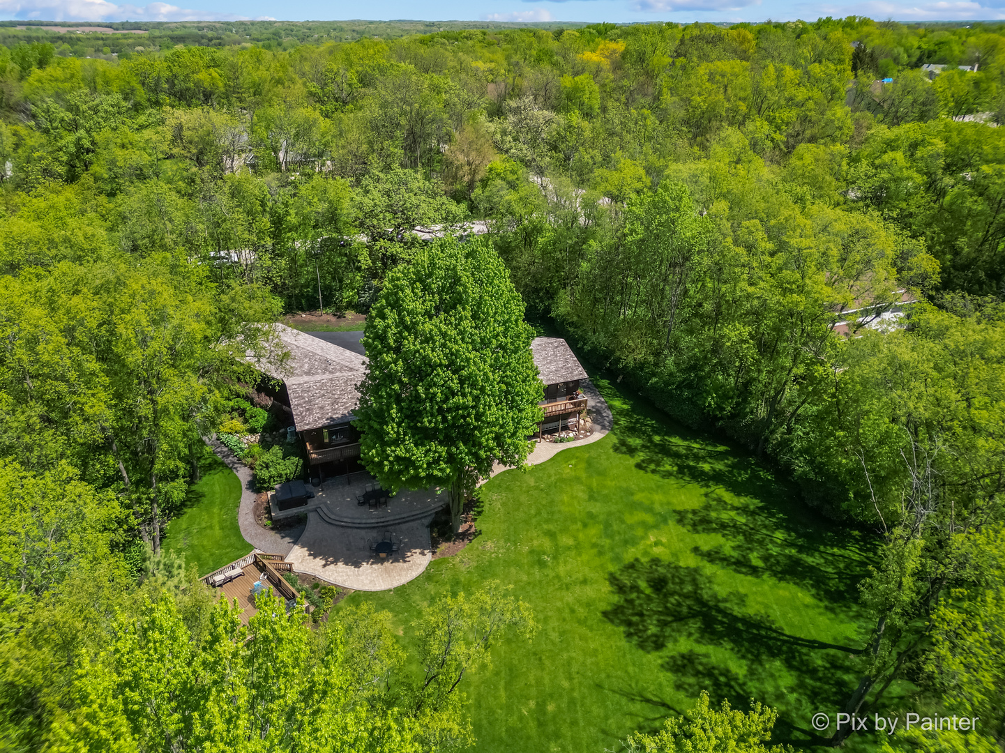 3804 Ridge Road Spring Grove, IL 60081 - Photo 47 of 55 a view of a backyard with plants and a garden