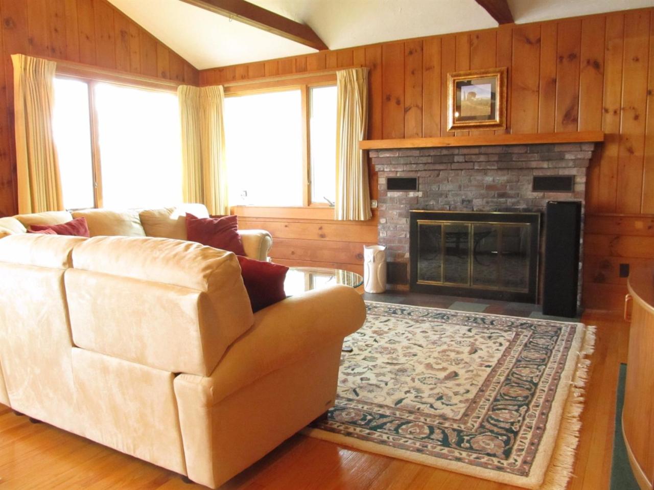 248 Pimlico Pond Road Mashpee, MA 02649 - Photo 14 of 22 a living room with a couch and a fireplace
