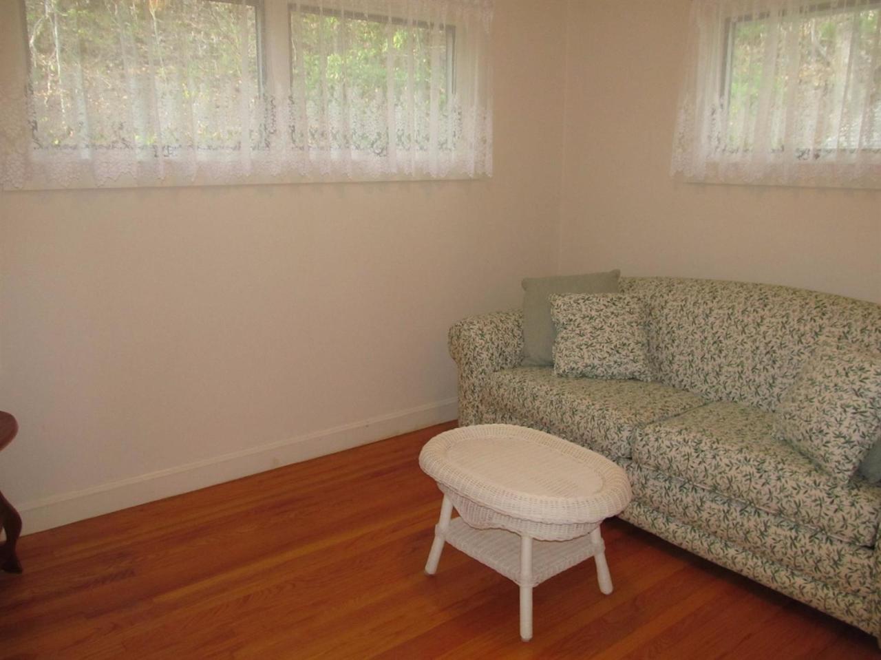 248 Pimlico Pond Road Mashpee, MA 02649 - Photo 16 of 22 a bathroom with a toilet a sink and a window