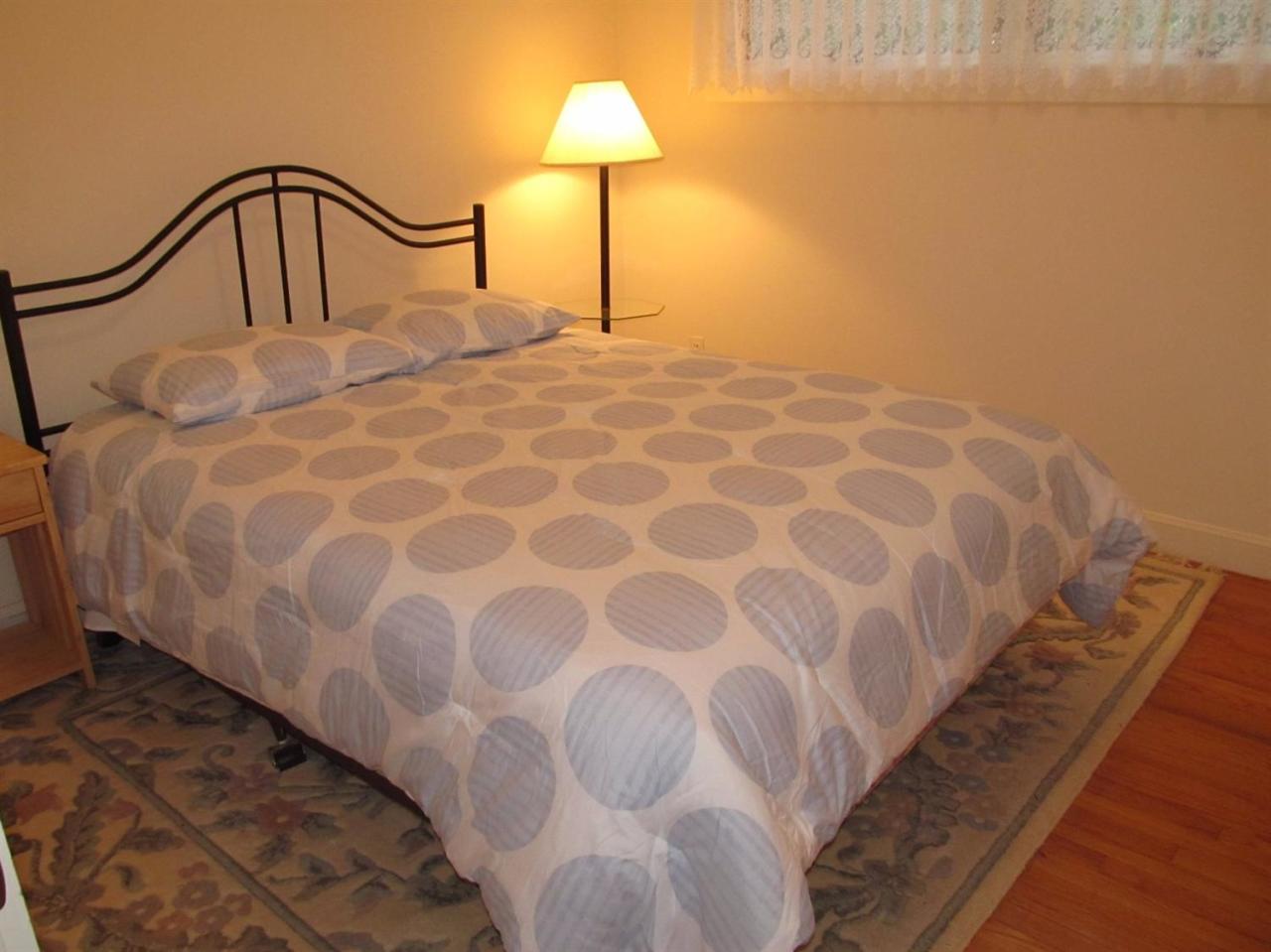 248 Pimlico Pond Road Mashpee, MA 02649 - Photo 17 of 22 a bedroom with a bed and a night stand