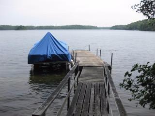 248 Pimlico Pond Road Mashpee, MA 02649 - Photo 5 of 22 a view of a balcony with wooden floor and lake view