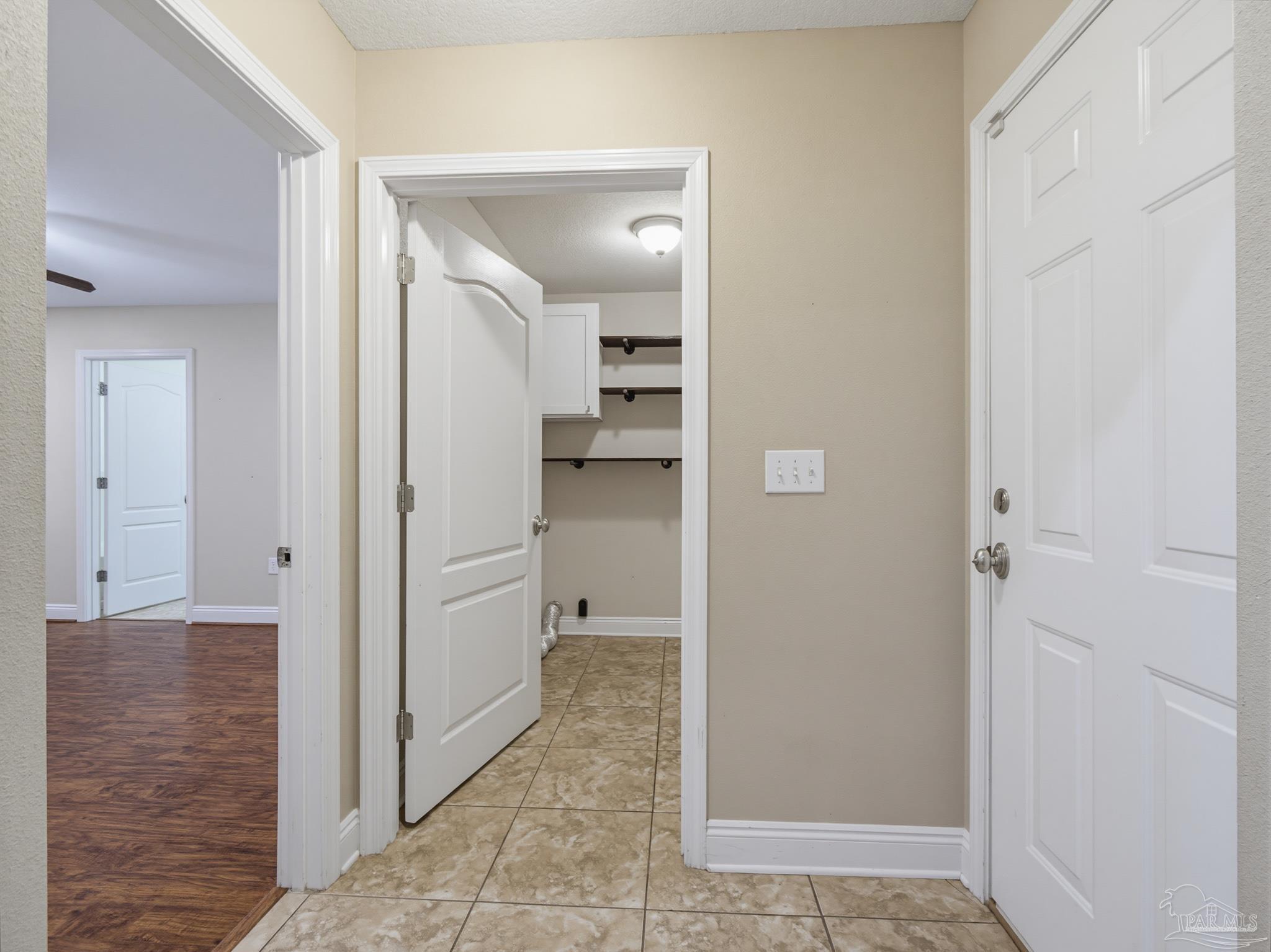 5567 Jones Street Milton, FL 32570 - Photo 22 of 48 a view of a hallway with a room