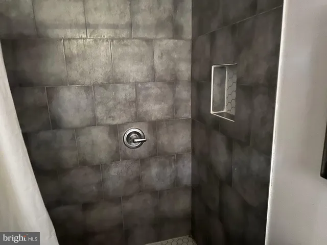 a close view of a shower in bathroom