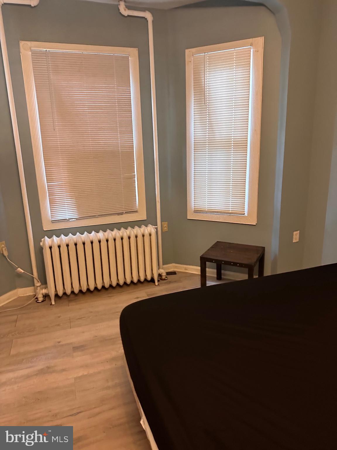 321 South Augusta Avenue Baltimore, MD 21229 - Photo 7 of 7 a front view of a house with a black gate