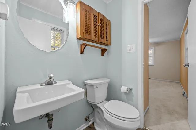a kitchen with a refrigerator sink and cabinets
