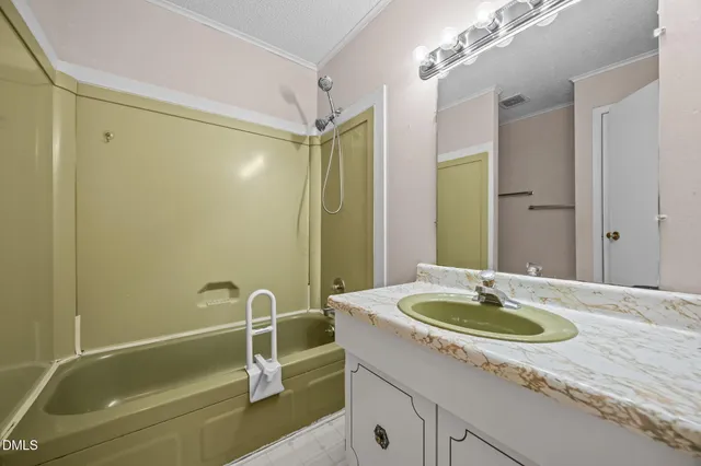 an empty room with fan and windows