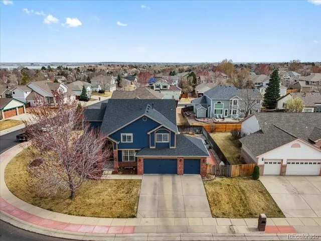 an aerial view of a house with a garden