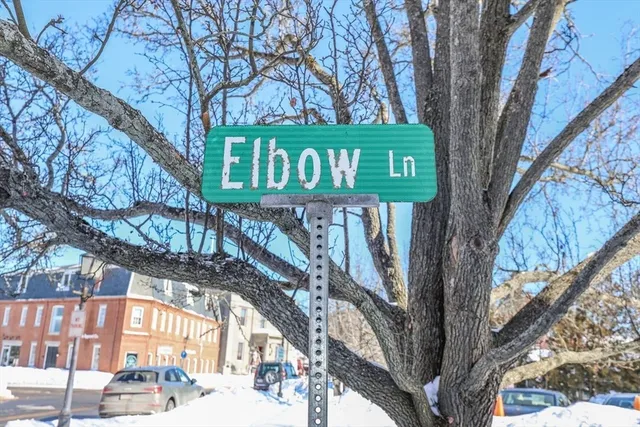 a view of a sign board with street