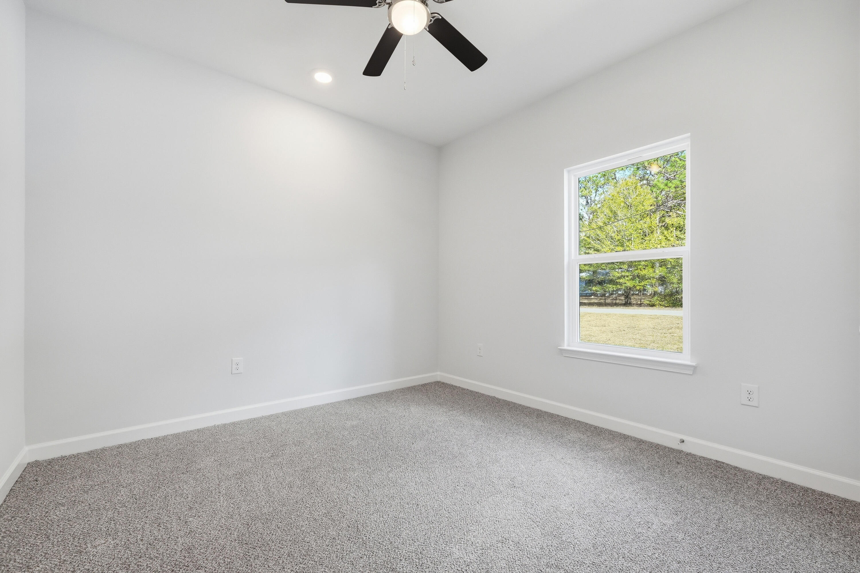 6138 Clover Street Crestview, FL 32539 - Photo 15 of 21 an empty room with a window