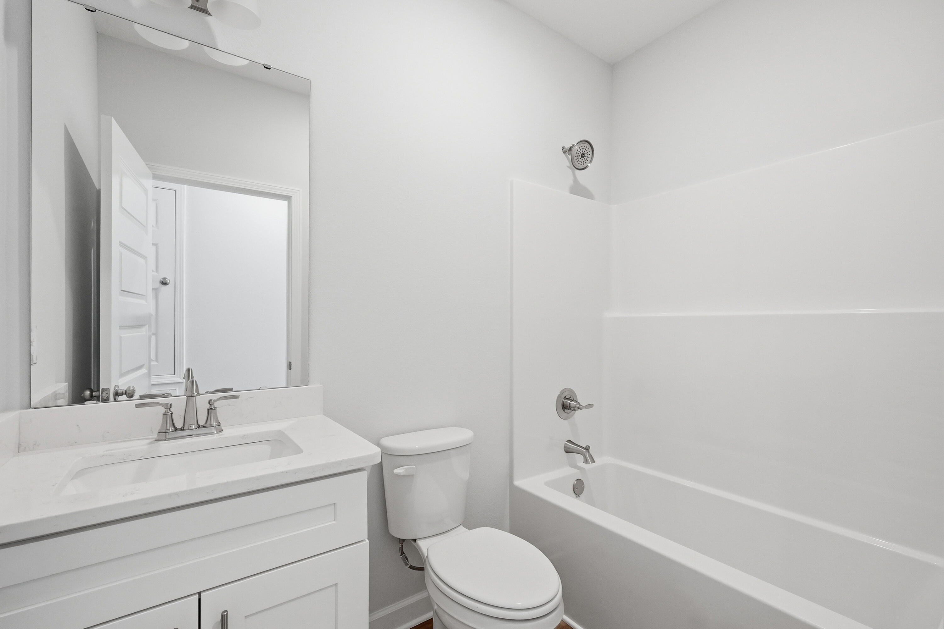 6138 Clover Street Crestview, FL 32539 - Photo 17 of 21 a bathroom with a sink toilet and shower