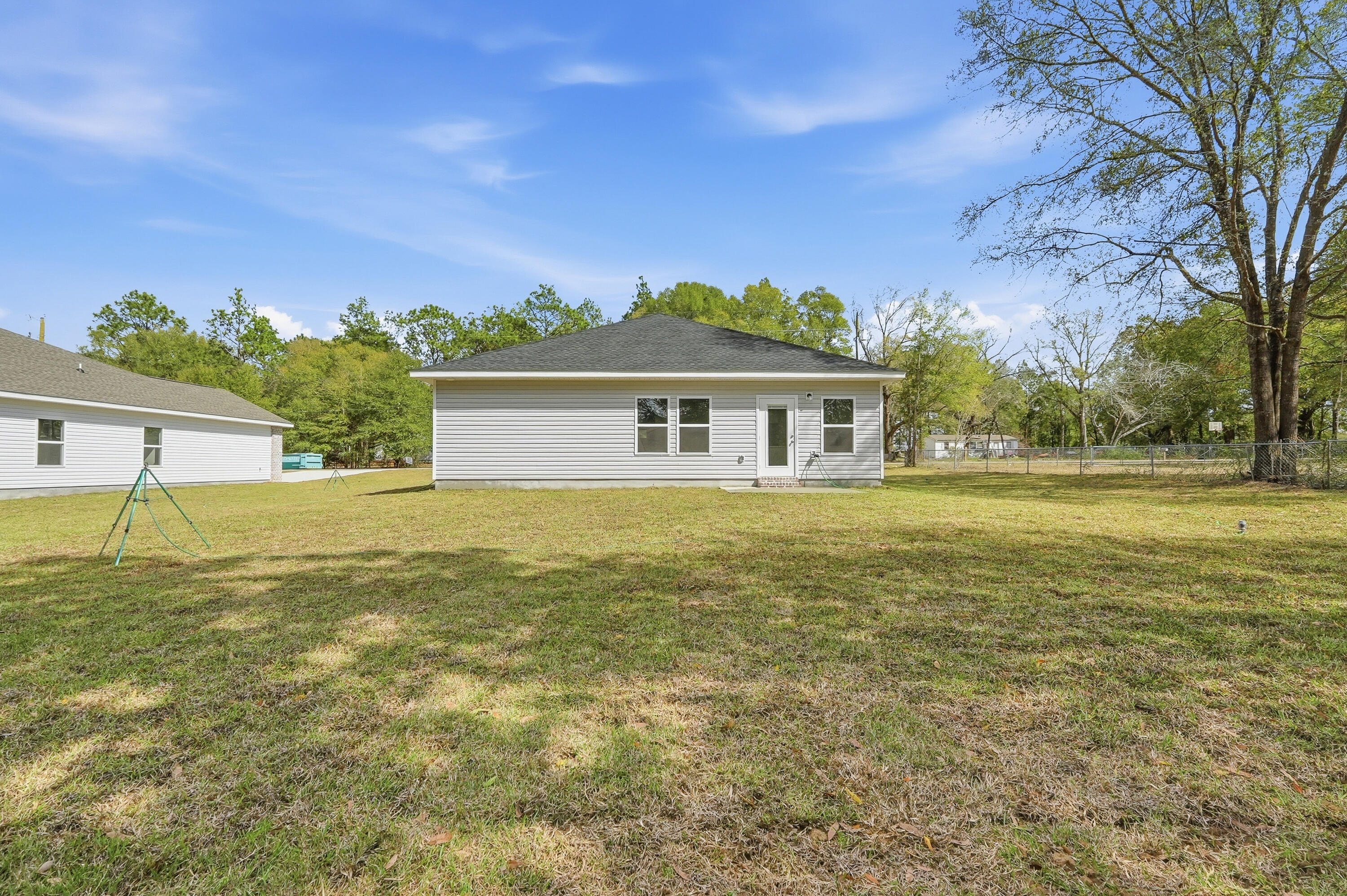 6138 Clover Street Crestview, FL 32539 - Photo 20 of 21 a house view with swimming pool in front of it