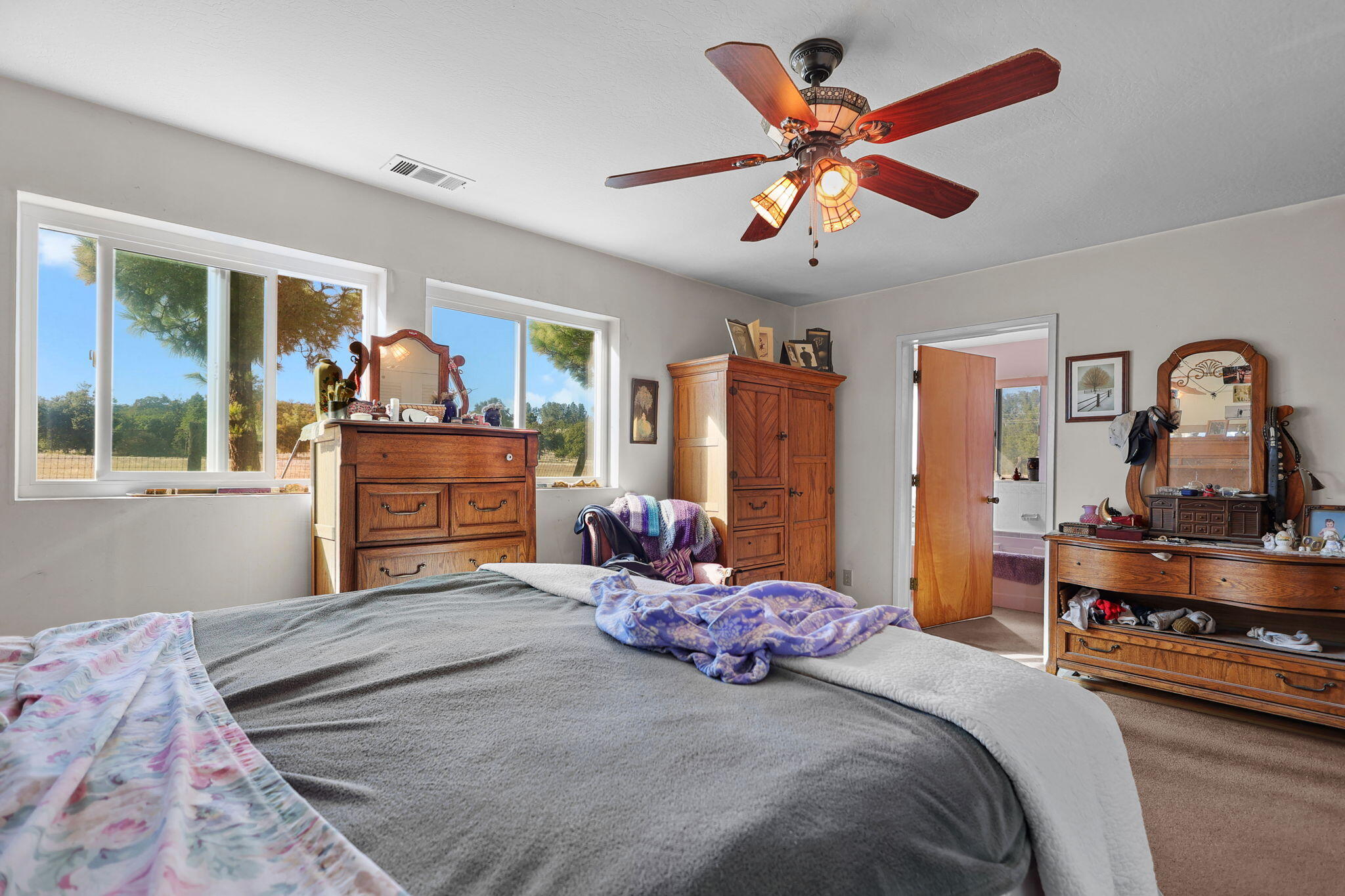 15015 Highway 36, Unit WEST Red Bluff, CA 96080 - Photo 12 of 51 a bedroom with bed and wooden floor