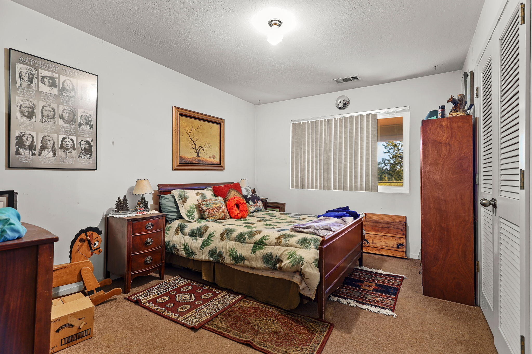 15015 Highway 36, Unit WEST Red Bluff, CA 96080 - Photo 15 of 51 a bedroom with a bed and wooden floor