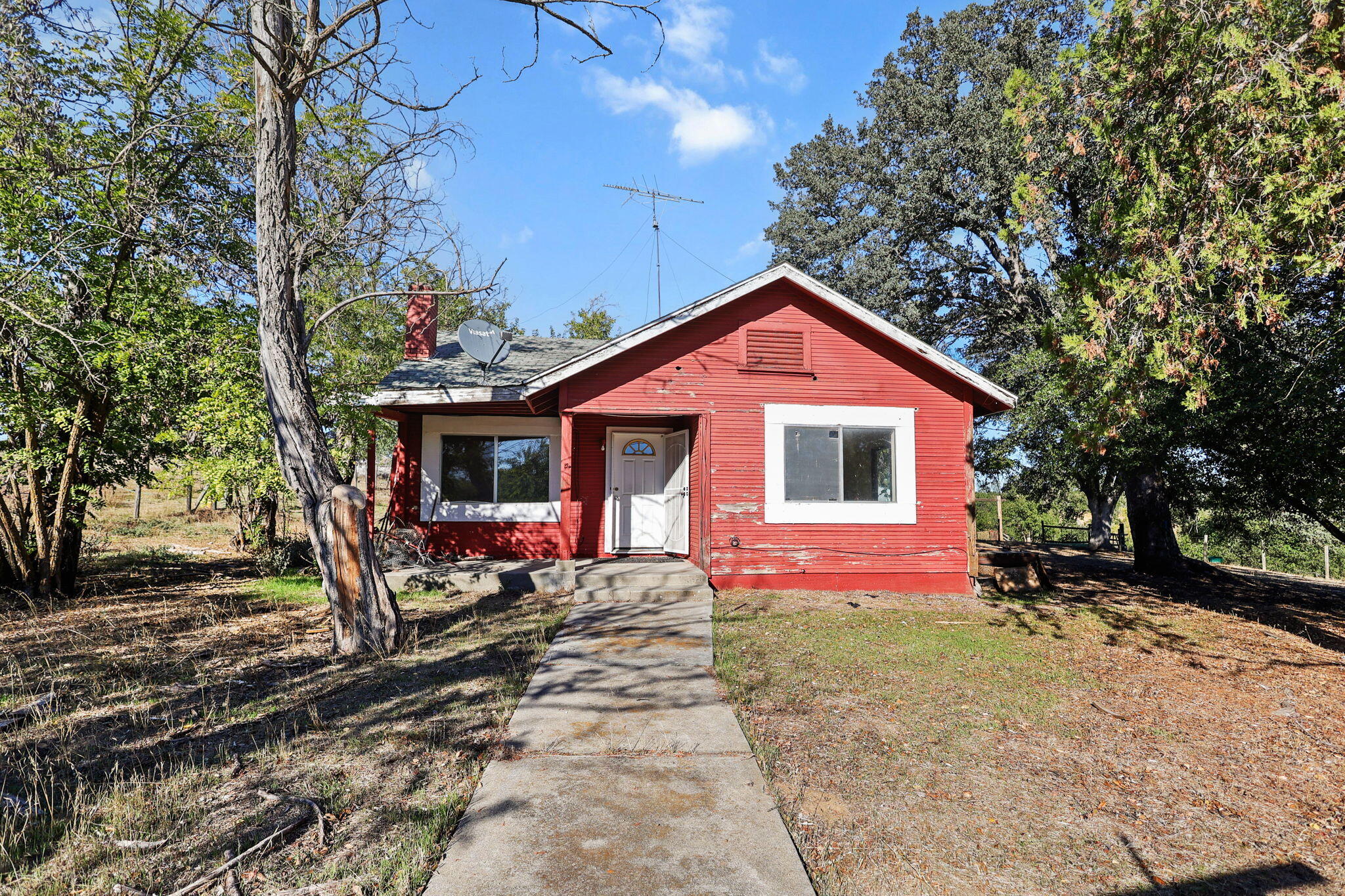 15015 Highway 36, Unit WEST Red Bluff, CA 96080 - Photo 2 of 51 a front view of a house with a yard