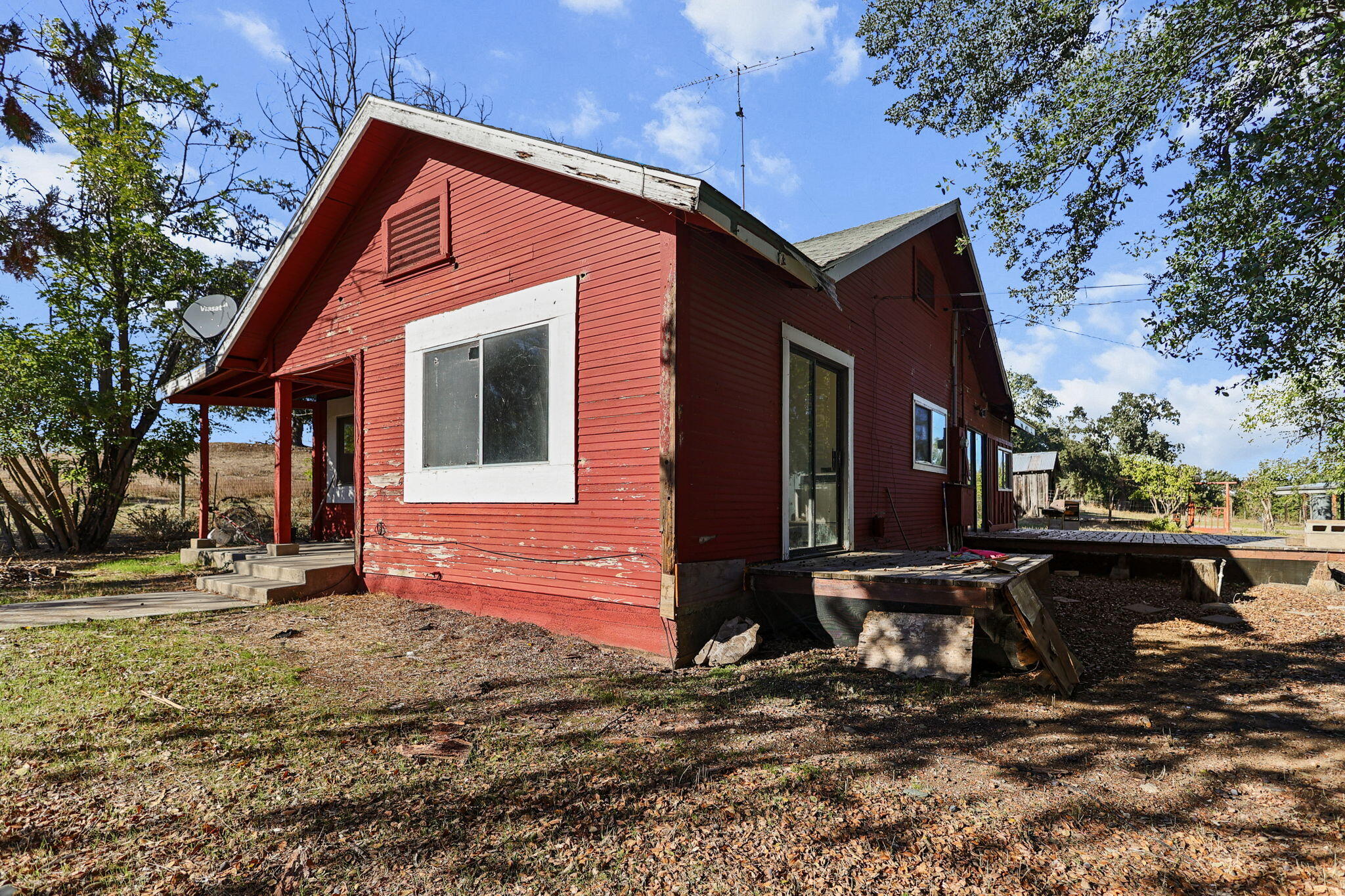 15015 Highway 36, Unit WEST Red Bluff, CA 96080 - Photo 21 of 51 a front view of a house with a yard