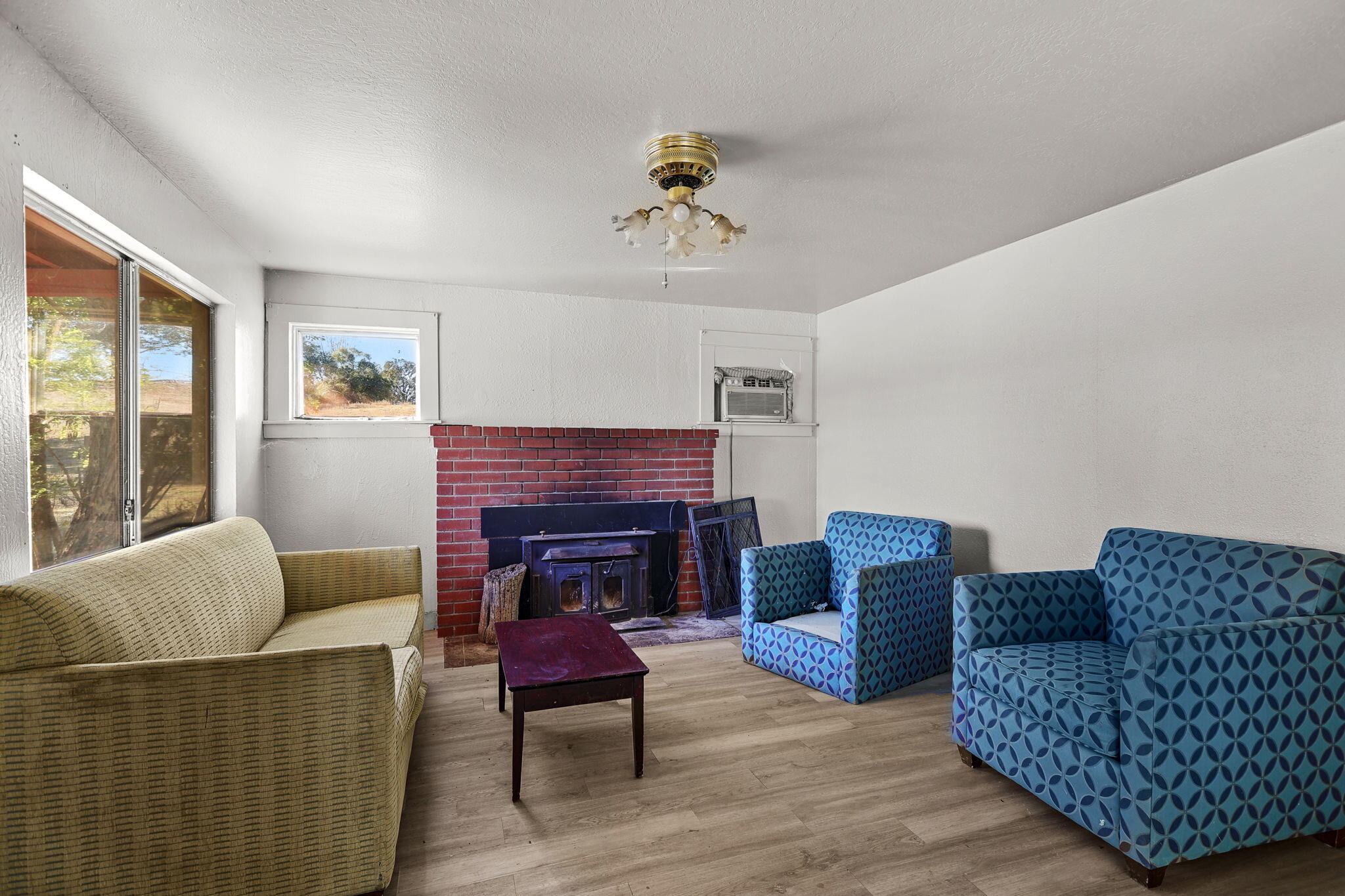 15015 Highway 36, Unit WEST Red Bluff, CA 96080 - Photo 22 of 51 a living room with furniture a fireplace and a window
